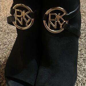 DKNY Black and Gold Ankle Booties with Logo Medallions